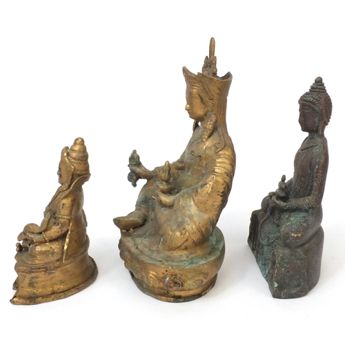 566 - Group of three Chinese cast metal Tibetan Buddha's, the tallest 23cm high