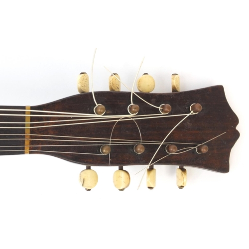 352 - Inlaid wooden mandolin with faux tortoiseshell guard plate, bone pegs and part paper label to the in... 