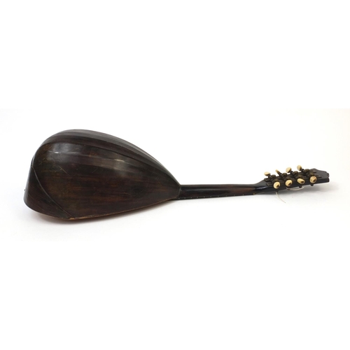 352 - Inlaid wooden mandolin with faux tortoiseshell guard plate, bone pegs and part paper label to the in... 