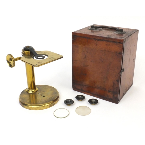 41 - Negretti & Zambra of London brass adjustable microscope with lenses, housed in a fitted mahogany cas... 