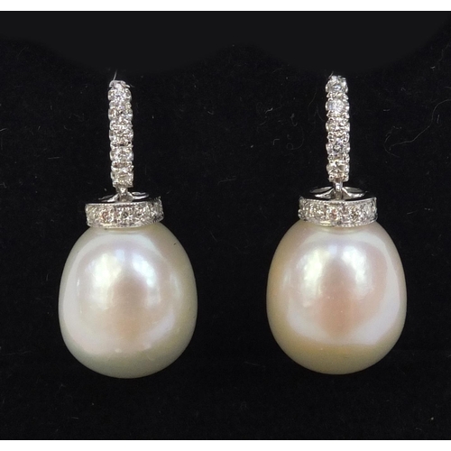 822 - Pair of 18ct white gold pearl drop and diamond earrings, 2,5cm high, approximate weight 6.6g