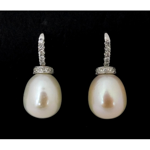 822 - Pair of 18ct white gold pearl drop and diamond earrings, 2,5cm high, approximate weight 6.6g