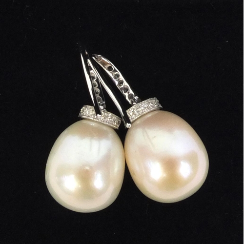 822 - Pair of 18ct white gold pearl drop and diamond earrings, 2,5cm high, approximate weight 6.6g