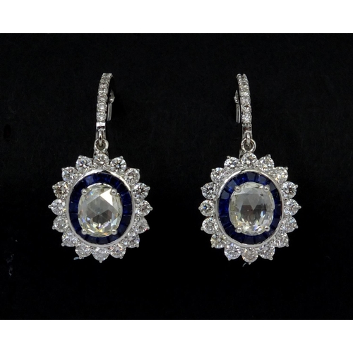 803 - Pair of 18ct white gold oval sapphire and brilliant cut diamond drop earrings, 3.2cm long, approxima... 