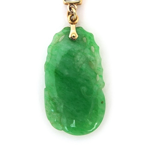 516 - Chinese carved green jade and aquamarine pendant on an 18ct gold necklace, the pendant 7.5cm long, a... 