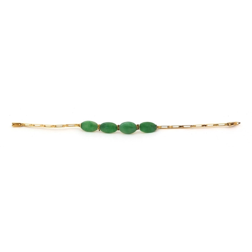 522 - Chinese 9ct gold green jade bracelet, set with four stones, 16cm long, approximate weight 5.0g