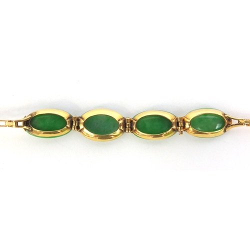 522 - Chinese 9ct gold green jade bracelet, set with four stones, 16cm long, approximate weight 5.0g