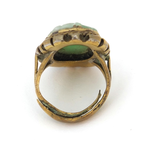 519 - ** DESCRIPTION AMENDED 15/9 ** Chinese carved green jadeite gilt metal ring, size J, approximate wei... 