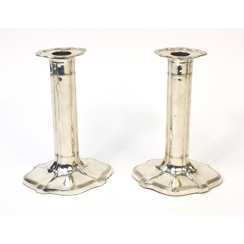 761 - Pair of silver column candlesticks with shaped bases, indistinct makers mark, Sheffield 1906, 19cm h... 