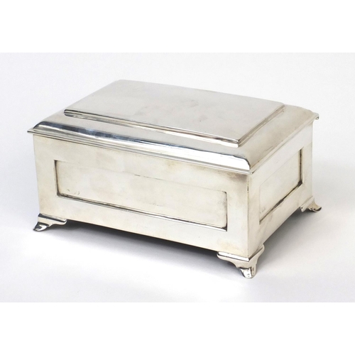 743A - William Comyns rectangular silver cigarette box in the form of a chest, indistinct London hallmark, ... 