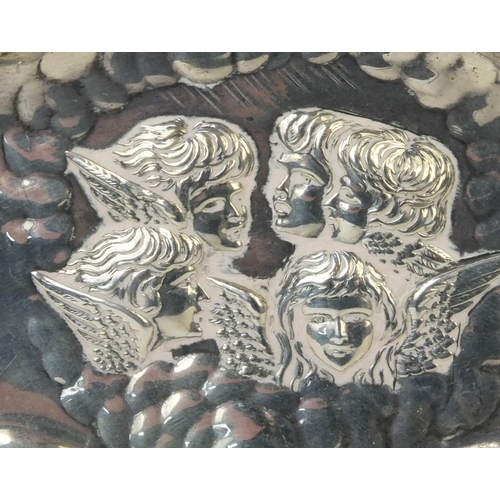 767 - Twin handled silver dish embossed with putti, hallmarked Birmingham 1904, 17cm long, approximate wei... 