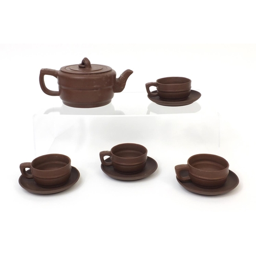 495 - Chinese yixing terracotta tea service comprising a teapot and four cups and saucers, character marks... 