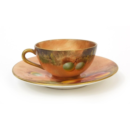 605 - Miniature Royal Worcester cup and saucer hand painted with fruit, signed, factory marks to the base ... 