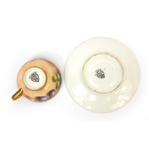 605 - Miniature Royal Worcester cup and saucer hand painted with fruit, signed, factory marks to the base ... 