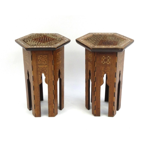 334 - Pair of hexagonal moorish tables inlaid with Mother of Pearl, each 48cm high x 30cm in diameter