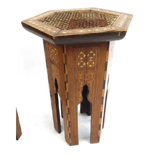 334 - Pair of hexagonal moorish tables inlaid with Mother of Pearl, each 48cm high x 30cm in diameter