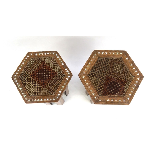 334 - Pair of hexagonal moorish tables inlaid with Mother of Pearl, each 48cm high x 30cm in diameter