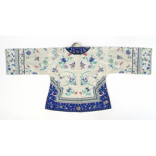 579 - Chinese silk kimono embroidered with phoenixes, butterflies and flowers, 60cm high