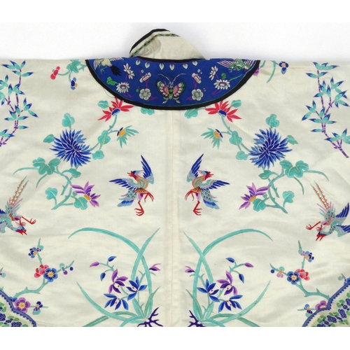 579 - Chinese silk kimono embroidered with phoenixes, butterflies and flowers, 60cm high