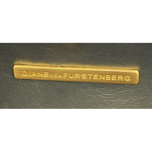 200 - Diane Von Furstenberg brown and white pattern clutch bag, plaque to the interior, 9cm high