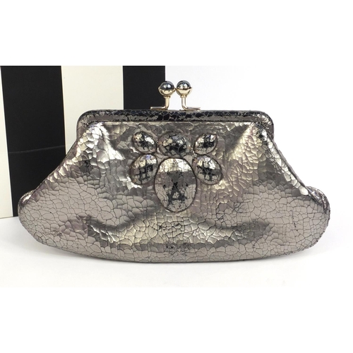 199 - Anya Hindmarch silver colour leather clutch bag, label to the interior, 13cm high