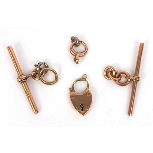 863 - Two 9ct gold T-Bar pendants, 9ct gold padlock and a 9ct gold clasp, approximate weight 11.9g