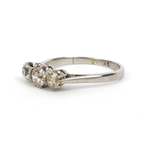 854 - Platinum three stone diamond ring, size K, approximate weight 2.7g