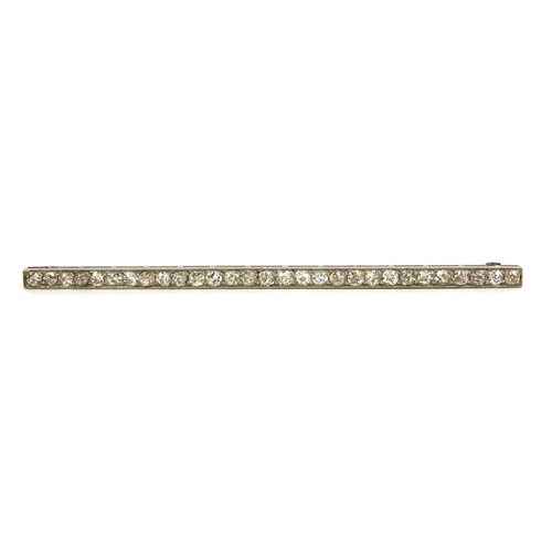 810 - Art Deco unmarked diamond bar brooch set with twenty nine diamonds, 8cm long, approximate weight 6.0... 