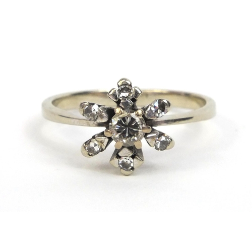 851 - Unmarked white metal diamond flower head ring, size N, approximate weight 3.6g