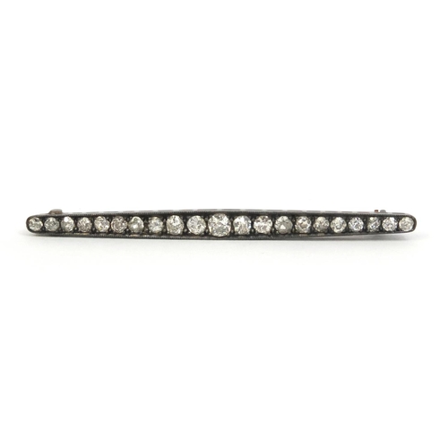 829 - Unmarked Art Deco diamond bar brooch set with twenty one diamonds, 6cm long, approximate weight 3.5g