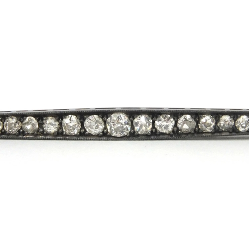 829 - Unmarked Art Deco diamond bar brooch set with twenty one diamonds, 6cm long, approximate weight 3.5g