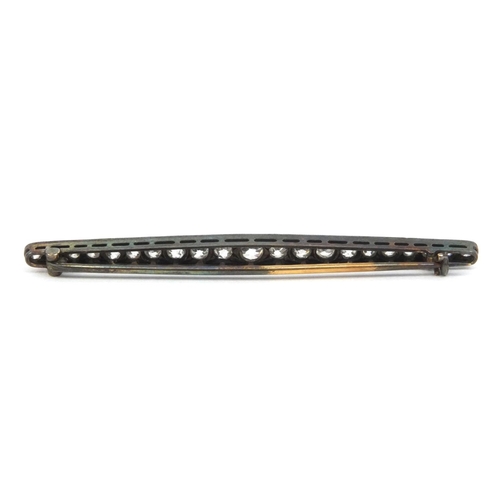 829 - Unmarked Art Deco diamond bar brooch set with twenty one diamonds, 6cm long, approximate weight 3.5g