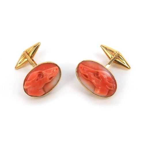 805 - Pair of 18ct gold greyhound carved coral cufflinks, approximate weight 9.8g