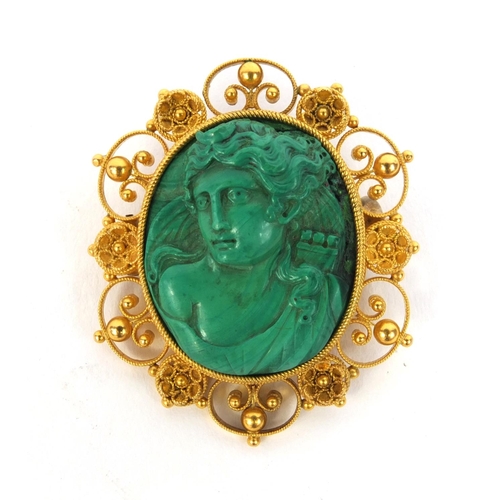 846 - Dianna the huntress carved malachite brooch, with unmarked gold mount, 4cm high, approximate weight ... 