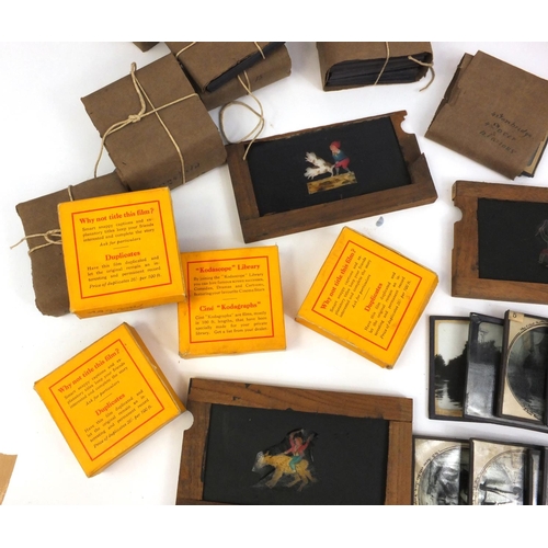 218 - Large collection of photographic glass slides, some coloured, including moving magic lantern slides,... 