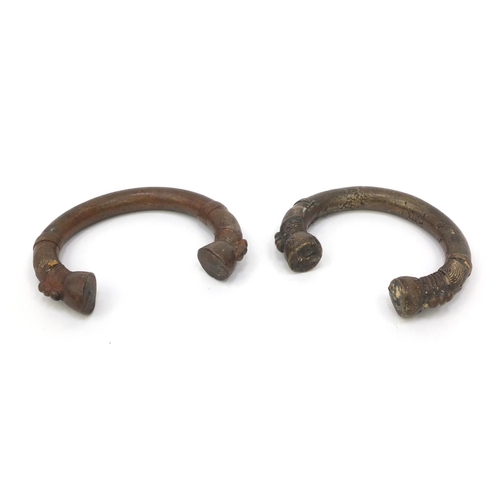 332 - Two African bronze bangles, each 10cm wide