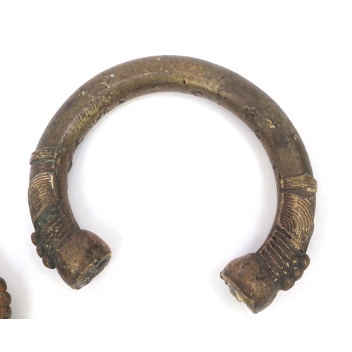 332 - Two African bronze bangles, each 10cm wide