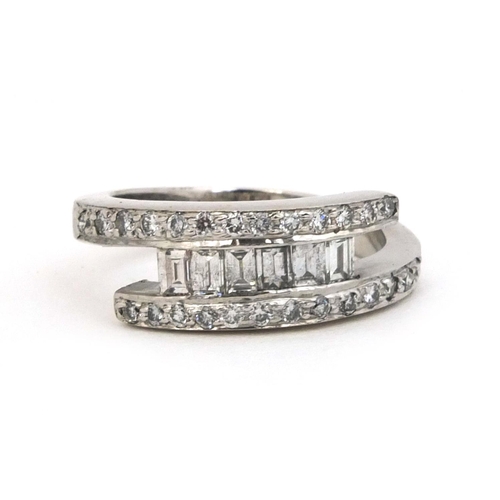 831 - Stylish 18ct white gold diamond ring, size G and matching earrings, approximate weight 10.6g