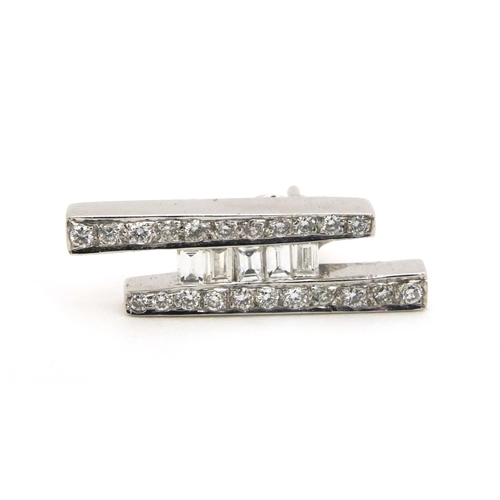 831 - Stylish 18ct white gold diamond ring, size G and matching earrings, approximate weight 10.6g