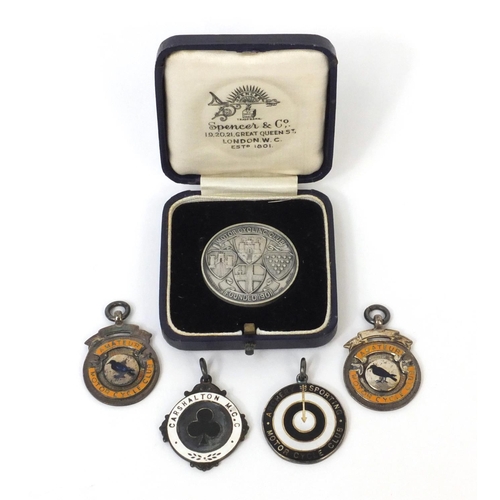180 - Group of four silver and enamel motor cycle jewels together with a motorcycling club silver award, e... 