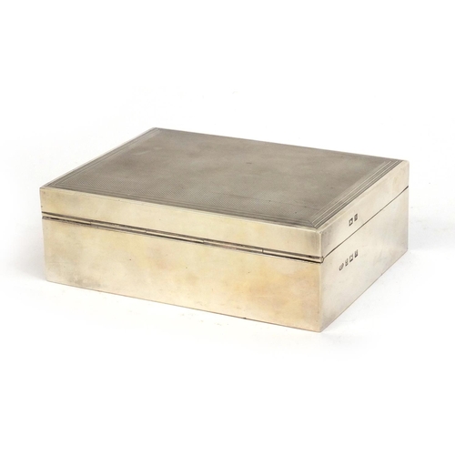 777 - Rectangular silver cigarette box, the lid with engine turned decoration, W.G Birmingham 1957, 11.5cm... 
