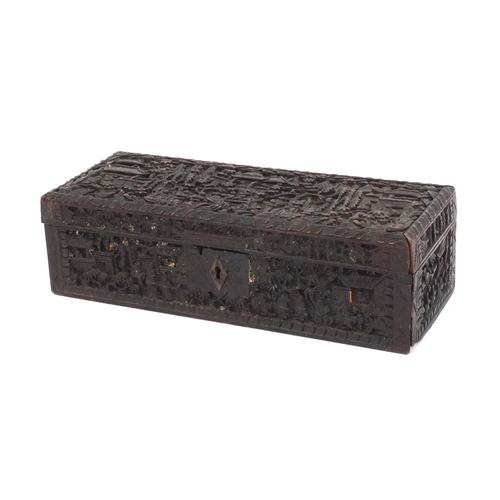 545 - Chinese Cantonese wooden glove box with hinged lid profusely carved with figures amongst pagodas and... 