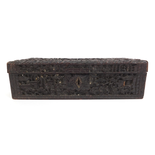 545 - Chinese Cantonese wooden glove box with hinged lid profusely carved with figures amongst pagodas and... 