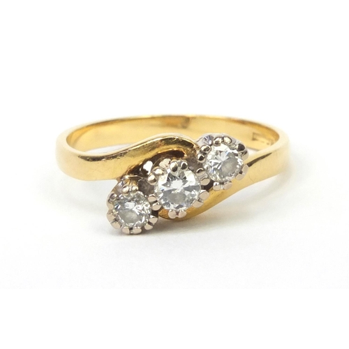 825 - 18ct gold modern round brilliant cut diamond three stone crossover ring, size L, approximate weight ... 