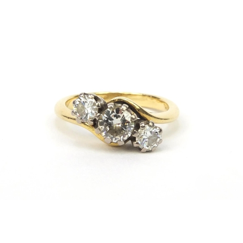 837 - 18ct gold modern round brilliant cut diamond three stone crossover ring, size L, approximate weight ... 