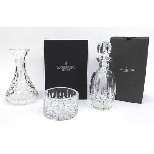 2307 - Group of Waterford Crystal comprising boxed decanter, boxed vase and a wine coaster, the tallest 30c... 