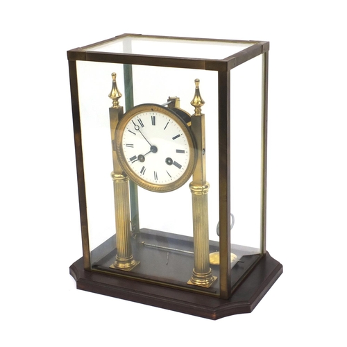 2331 - Brass mantle clock with enamelled dial striking on a bell, house under a brass and glass case, 31cm ... 