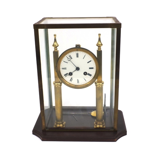 2331 - Brass mantle clock with enamelled dial striking on a bell, house under a brass and glass case, 31cm ... 