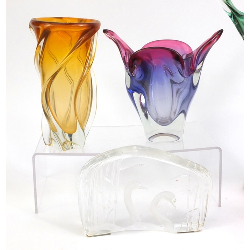 2304 - Group of glassware comprising Kosta Boda swan paperweight and four colourful art glass bowls, the ta... 