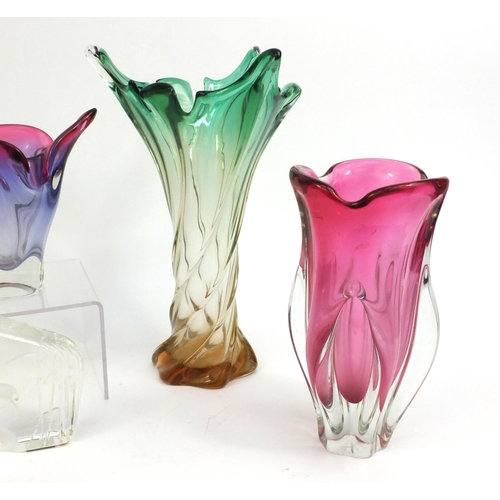 2304 - Group of glassware comprising Kosta Boda swan paperweight and four colourful art glass bowls, the ta... 